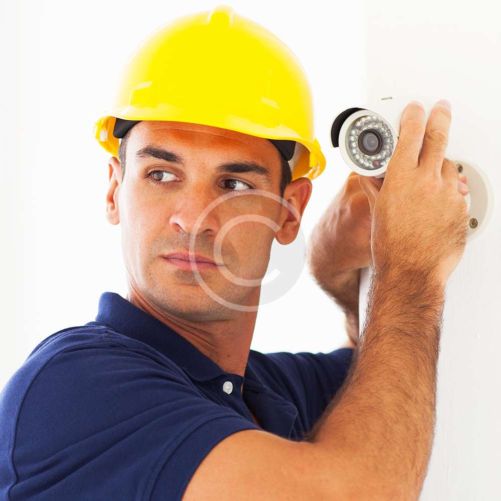 cctv technician adjusting camera angle Simaa Security Systems LLC